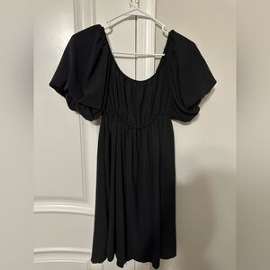 Black short dress with puffy sleeves that can turn into off the shoulder sleeves